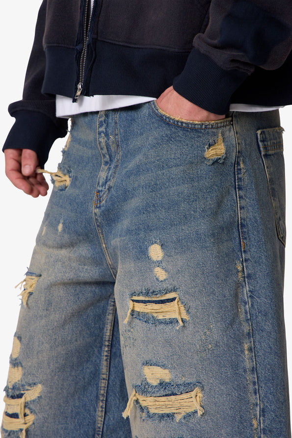 RETROFOLD ULTRA BAGGY REPAIRED DENIM SHORTS